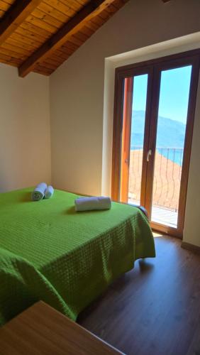 Postel nebo postele na pokoji v ubytování Agriturismo Runchee