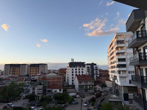 a view of a city with tall buildings at Riga's Apartment in Prizren