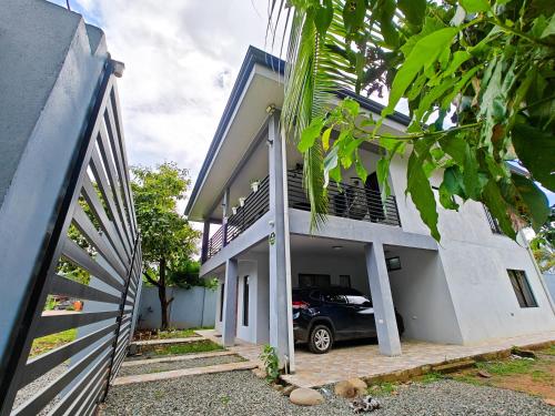 a car parked in the garage of a house at AJ House & Suites in Uvita