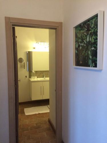 a bathroom with a sink and a mirror at Collina Di Sopra in Tresana