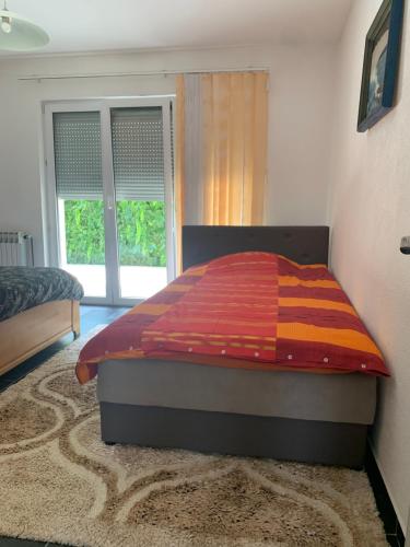 Ένα ή περισσότερα κρεβάτια σε δωμάτιο στο Green Garden Ilidza