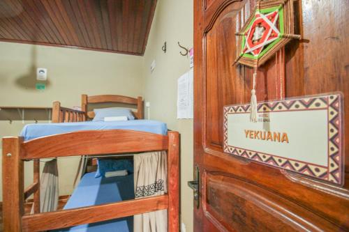 a door to a room with two bunk beds at Hostel Roraima in Boa Vista