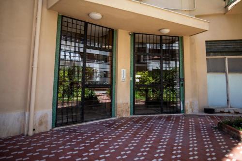an entrance to a building with two glass doors at CefaLux - Apartments in Cefalù