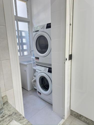 a washing machine and a washer and dryer in a bathroom at Luxury apartments Alamos beach Torremolinos - Costa Lago in Torremolinos