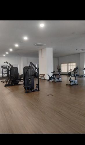 an empty gym with several exercise bikes in a room at Dhia Homestay Sireh Residence Near Aeon Mall in Kota Bharu