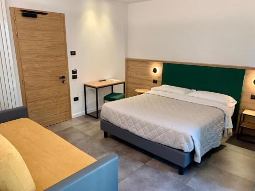 Hotel Locanda Alla Perlaにあるベッド