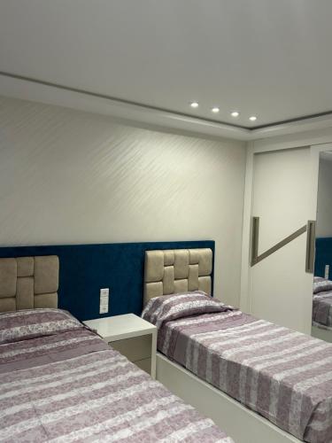 Una cama o camas en una habitación de APPRT Residence Ahmed