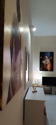 a living room with a large painting on the wall at Pyrgos Hotel Apartments in Kremasti