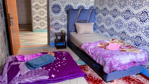 Postel nebo postele na pokoji v ubytování Tayrt Hostel