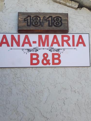 a sign for aarma maratha bbb on a wall at Ana-Maria Bnb in Tatʼev