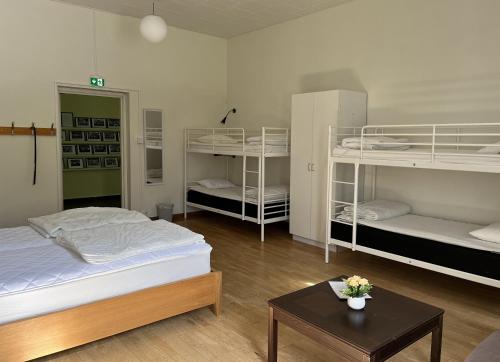 Postel nebo postele na pokoji v ubytování Körsbärskullen
