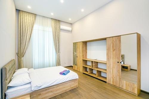 מיטה או מיטות בחדר ב-Apartment TESUTT