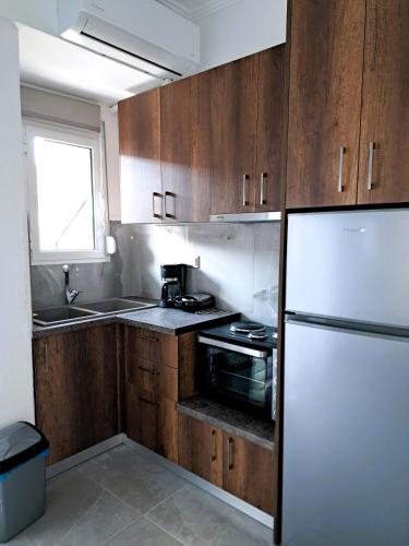 Kuchyň nebo kuchyňský kout v ubytování Mitende Apartments