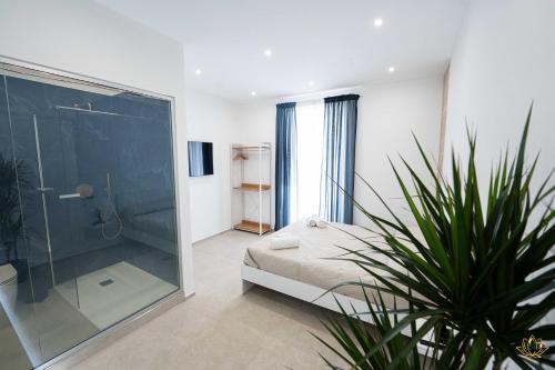 Ένα μπάνιο στο Nymphē Ortigia Apartments