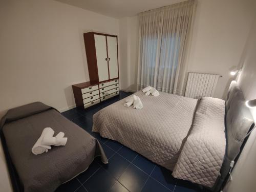 Ένα ή περισσότερα κρεβάτια σε δωμάτιο στο A Casa di Jenny