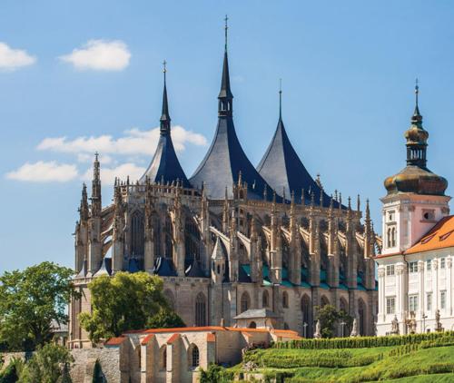 a large building with pointed spires on top of it at Apartmán Strakosch in Kutná Hora