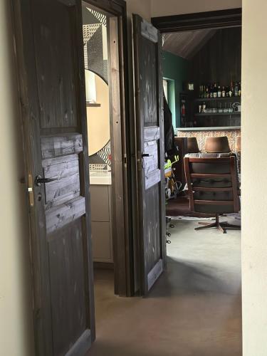 an open door to a room with a table at Kõrvalhoone in Pirgu