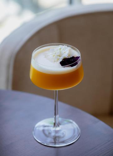 a glass with a dessert in it on a table at L'Horloge - Appart'Hotel proche de Disneyland in Montévrain