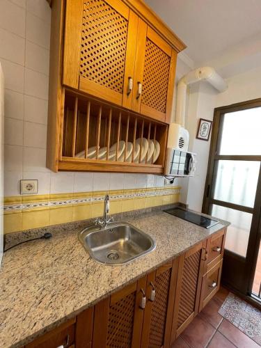 a kitchen with a sink and a counter top at Juanita La Larga in Doña Mencía