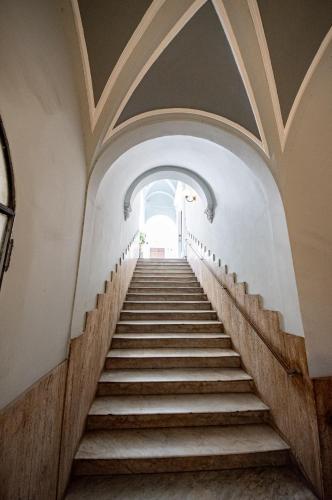 a staircase in an old building with a window at Principe del Pardo in Catania