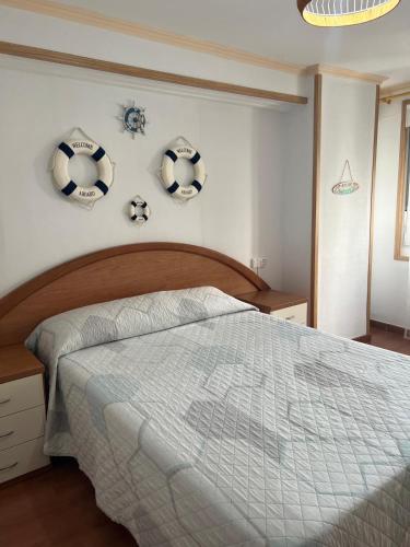 a bedroom with a bed with soccer balls on the wall at Casa Familiar con barbacoa in Finisterre