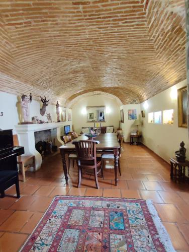 a living room with a table and a fireplace at Casa De Terena in Terena