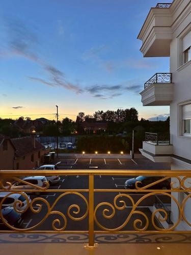 a view of a parking lot from a balcony at MANIROSI 19 PALIC - Apartment in Palić
