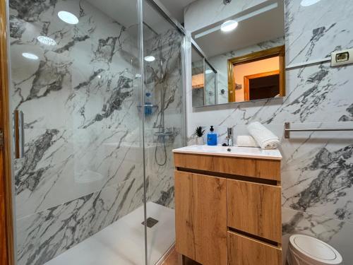 a bathroom with a shower and a sink at Nature Somhome Peñíscola in Peñíscola