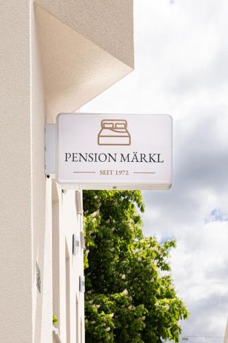 a sign for a fashion market on the side of a building at Pension Märkl Augsburg in Augsburg