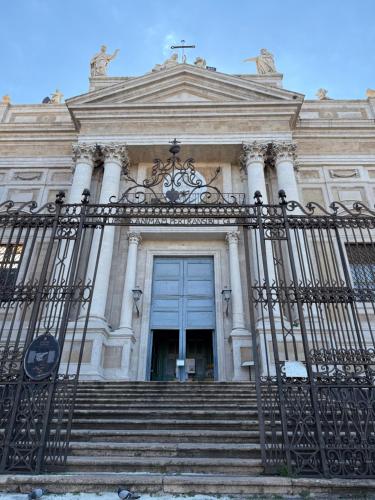a building with a gate and stairs in front at Aradas Home in Catania