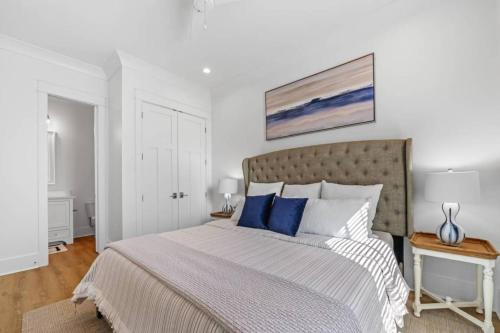 a bedroom with a large bed with blue pillows at Gorgeous Gerev Home in Oberlech