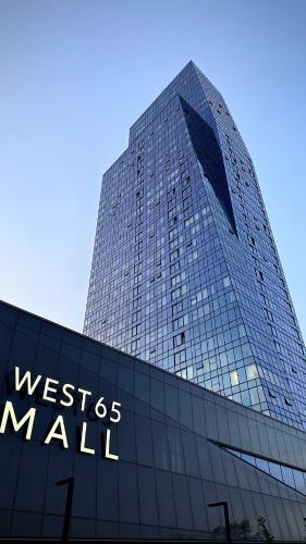 a tall building with the words west des mall on it at West 21 Tower in Fontana