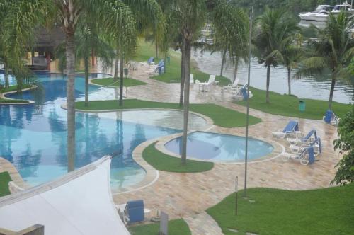 Kolam renang di atau dekat dengan Flat particular no Resort em Angra Dos Reis
