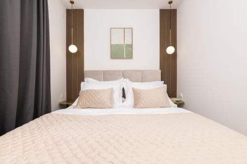 Ένα ή περισσότερα κρεβάτια σε δωμάτιο στο Apartments Belic with pool