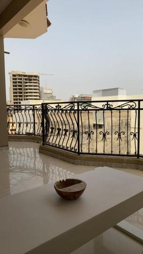 a bowl sitting on a table next to a balcony at Dakar Mermoz mz52 in Dakar