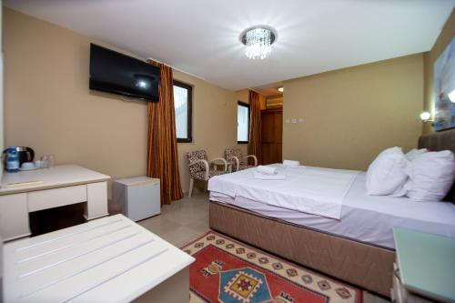Cama o camas de una habitación en New Hotel Kuč By Marvel