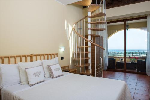 En eller flere senge i et værelse på 'A Nuciara Park Hotel & Spa
