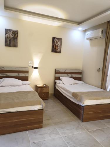 Postel nebo postele na pokoji v ubytování Lilyland Resort&water park