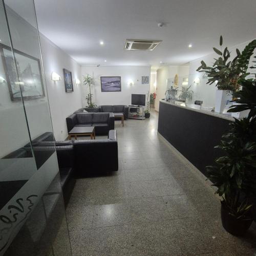 a lobby with couches and a waiting room at Apartamentos Turísticos Vila Praia in Vila Praia de Âncora