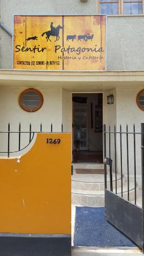 an entrance to a building with a sign on it at Sentir Patagonia in Viña del Mar