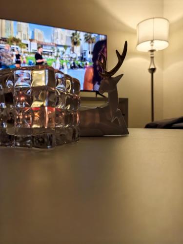 a statue of a deer sitting on top of a table at Ahlan New Horizon JBR in Dubai