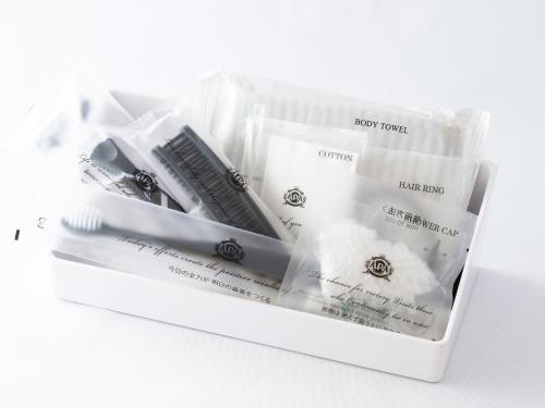 a package of four toothbrushes in a plastic container at APA Hotel Karuizawa Ekimae Karuizawaso in Karuizawa