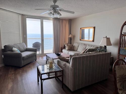 a living room with a couch and a table at Sunrise Pointe 11F Condo in Myrtle Beach