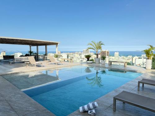 a swimming pool on the roof of a building at RARO Ipanema Boutique Hotel in Rio de Janeiro
