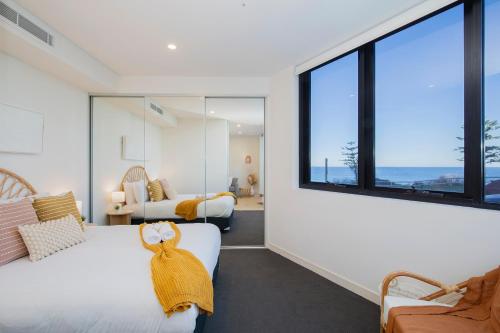 Ένα ή περισσότερα κρεβάτια σε δωμάτιο στο Surfside Newcastle Beach