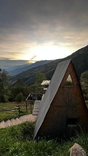 a small house sitting on top of a hill at Chalet Guadalupe - Girardota 