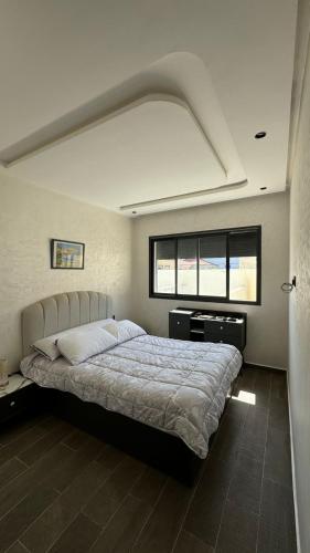 Ένα ή περισσότερα κρεβάτια σε δωμάτιο στο Appartement Mehdia