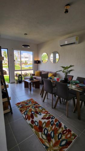 a living room with a couch and a table at Casa 3 recamaras con alberca compartida Acapulco diamante in General Juan N Alvarez International Airport
