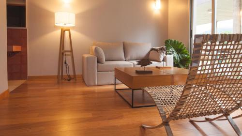 a living room with a couch and a table at Amalinas Hotel in San Lorenzo