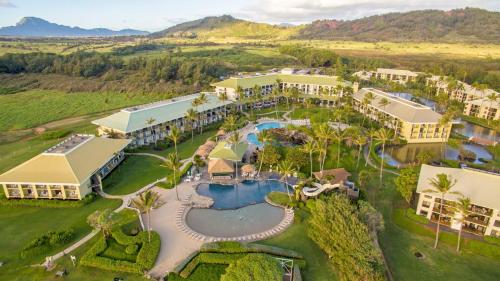 an aerial view of a resort with a swimming pool at Pool Oceanview Lanai, Beachfront 4-Star Resort, King Bed, AC, Pool, Restaurant, Gym, Spa in Lihue